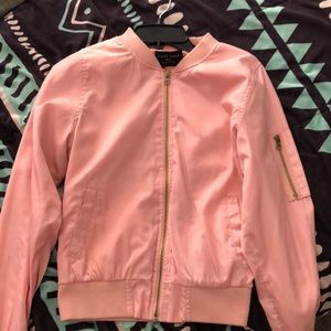 A pink windbreaker jacket